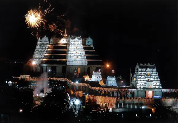 ISKCON Bangalore temple at night during the Brahmotsava festival