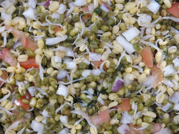 Sprouted moong chaat with onion and tomato, a close cousin of moong dal chaat